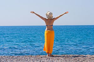 Self Trust - Woman with Outstretched Arms Overlooking Ocean